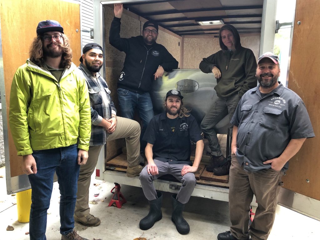 Stormcloud brewing Company Brewers posing with the Speciation Artisan Ales crew and coolship.